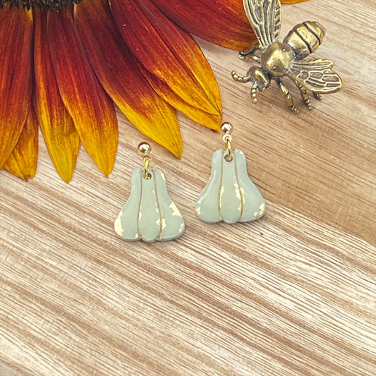 Gold Pumpkins Dangle in Moss